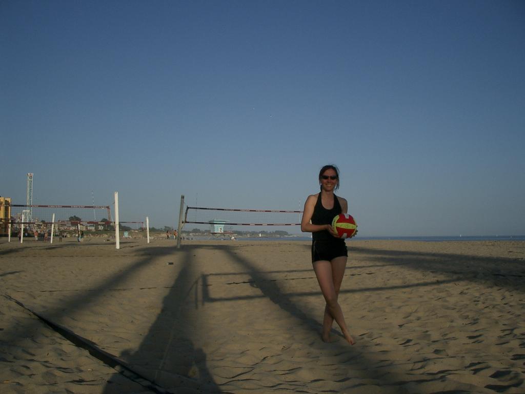 Pascale with the CUVC volleyball on the beach at Santa Cruz