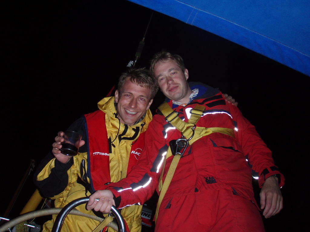 Jim and at the helm late at night approaching St. Peter's Port